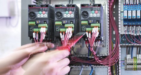 electric-heating-2 2 hands sorting out network cables