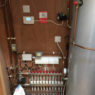Boiler tank installation with cables coming from the floor