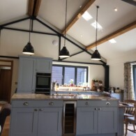 Home fitted with blue kitchen with long black drop down lights, Lakenheath
